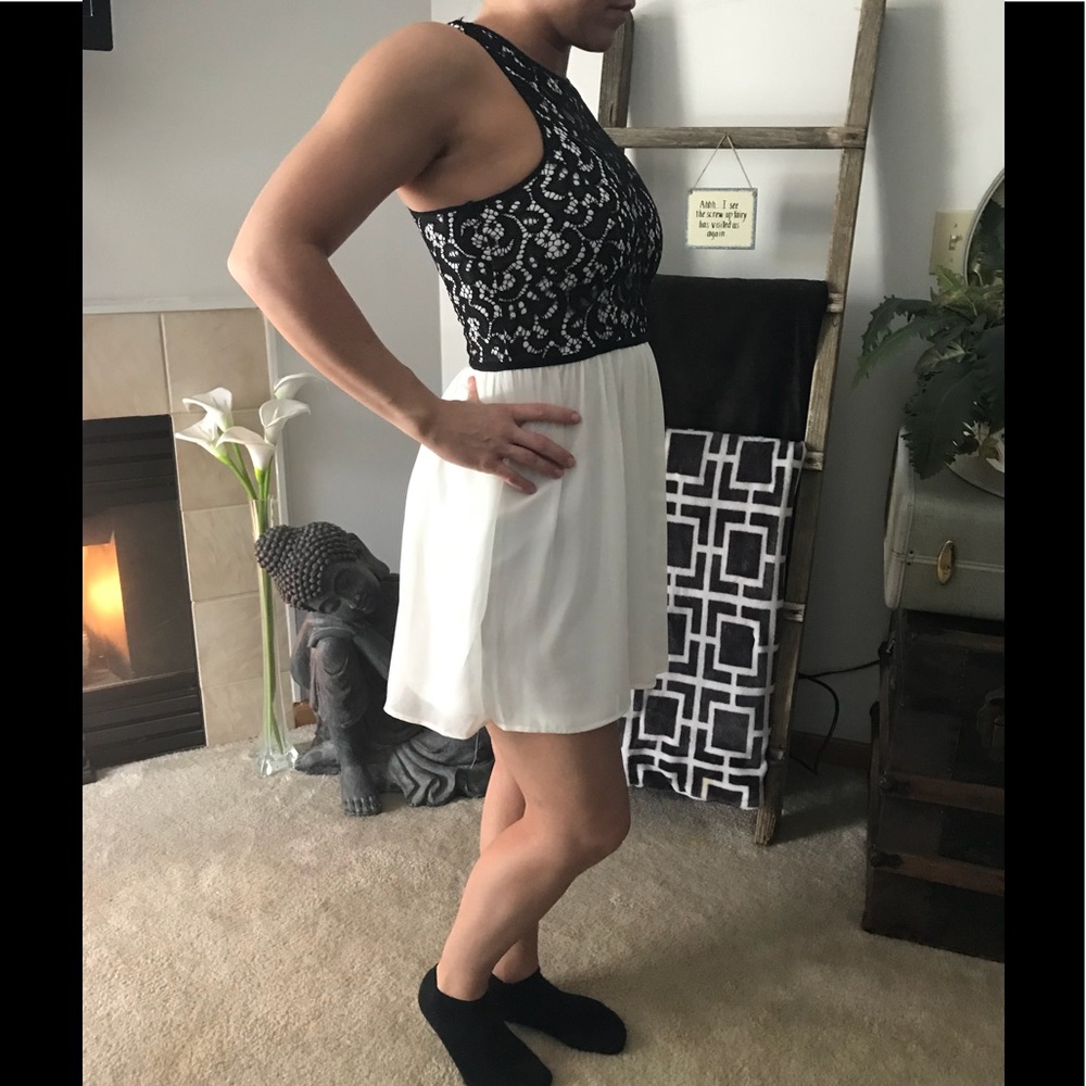 Beautiful black lace and white chiffon above knee.